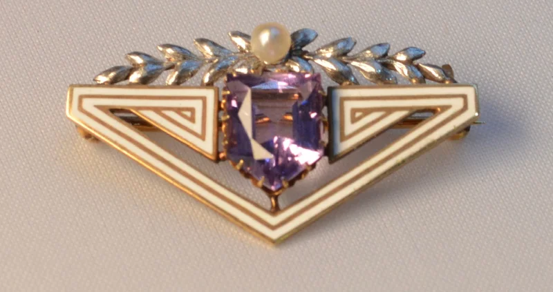 14K yellow gold brooch with white gold floral trim on top and Amethyst, with white enamel trims